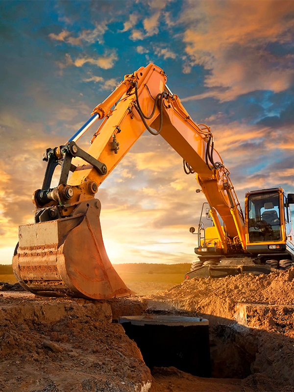 Excavator setting a septic tank